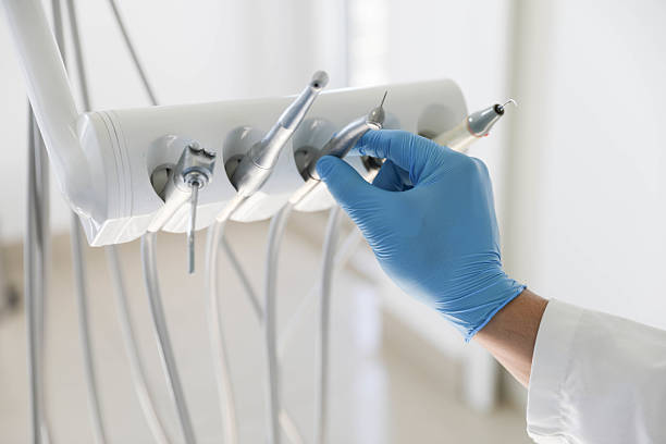 Professional Tooth Extraction technician working in Slater, MO